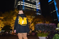 a person wearing a yellow backpack