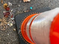 a traffic cone is sitting on the ground