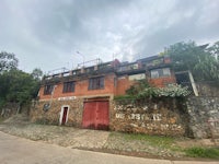 a red brick building on the side of a street