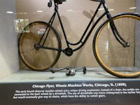 a bicycle is on display in a display case